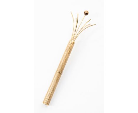 A 20th Century 9ct gold swizzle stick.