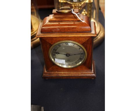A small Elliott mantle clock, mahogany case and Roman numerals (28262), working.