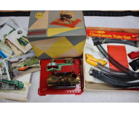 Mamod SE2 stationary, steam engine, together with a Hornby clockwork 00 set and booklets. 