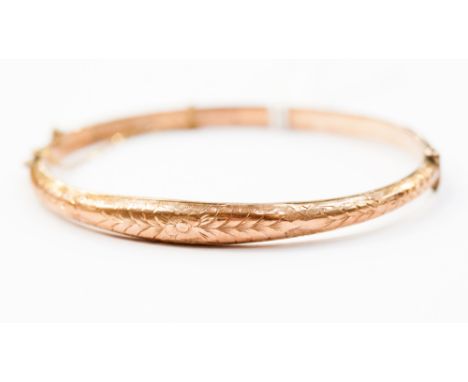 A 9ct rose gold hinged bangle, hallmarked 1902, complete in fitted box.