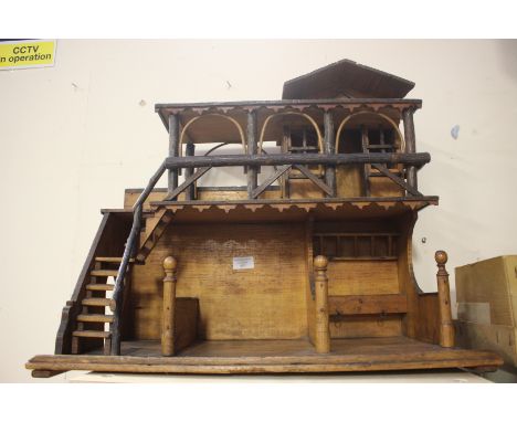 A 20th Century wooden model of a stable.