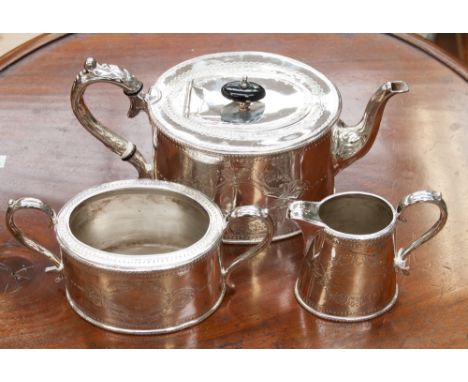 A late Victorian silver plated three piece tea service, comprising teapot, milk jug and sugar bowl, each piece stamped to und