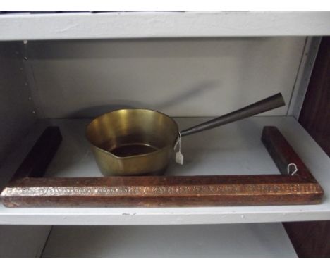 Vintage brass pan together with a copper fire surround 