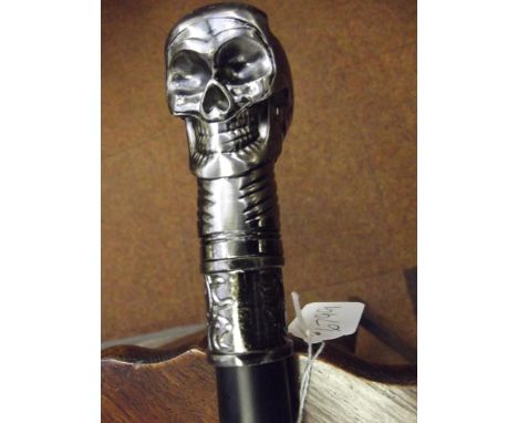 Walking stick with stylised skull finial 