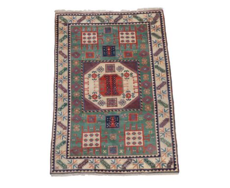 Turkish Carpet of Karachov Kazak Design, modern The mint green field of tribal motifs around an ivory octagon enclosed by ivo