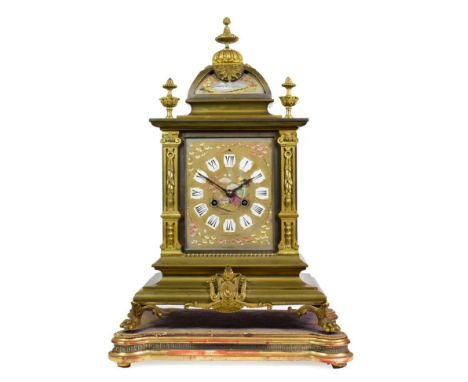 A Gilt Metal and Porcelain Mounted Striking Mantel Clock, circa 1880, caddied pediment with urn finials, caddy with a painted