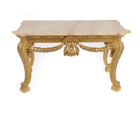 A Carved Giltwood Console Table, in the style of William Kent, the pink and yellow veined marble top with projecting corners 