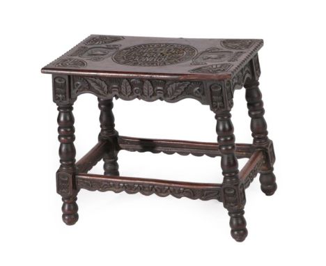 A Victorian Scottish Carved Oak Stool, late 19th century, the top carved with eagles and a central panel named Hector Munro, 