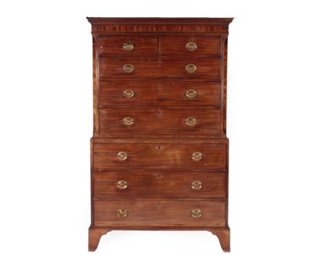 A George III Mahogany and Boxwood Strung Chest on Chest, circa 1800, the bold cornice above two short and three long drawers 