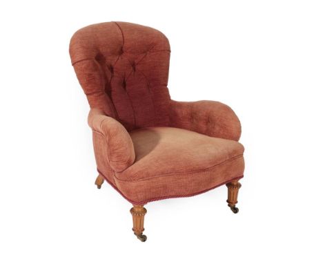 Gillow: A Victorian Upholstered Armchair, circa 1870, recovered in modern button chenille fabric, with overstuffed seat, on t