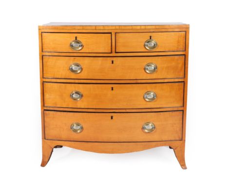 A George III Satinwood, Ebony Strung and Crossbanded Bowfront Chest of Drawers, early 19th century, of two short over three l