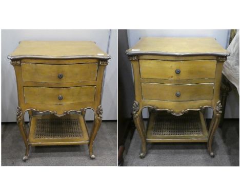 ~ A Pair of French Style Gilt Painted Two-Drawer Bedside Tables, modern, of serpentine shaped form, on cabriole legs joined b