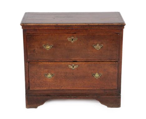 An Oak Crossbanded and Pine Lined Chest, the moulded top over two deep drawers, on bracket feet, the chest 18th century and a