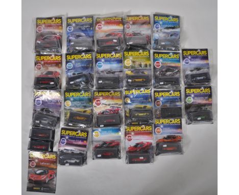 A large collection of assorted 1/43 scale Panini Collections ' Supercars ' diecast models with associated reference magazines