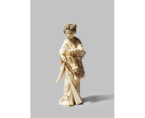 A JAPANESE IVORY OKIMONO MEIJI 1868-1912 Carved as a bijin holding a kokyu (string instrument), her kimono elaborately decora