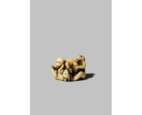 A JAPANESE IVORY NETSUKE EDO/MEIJI PERIOD Depicting a dog, a monkey and a rabbit wrestling, the latters' eyes inlaid in horn,