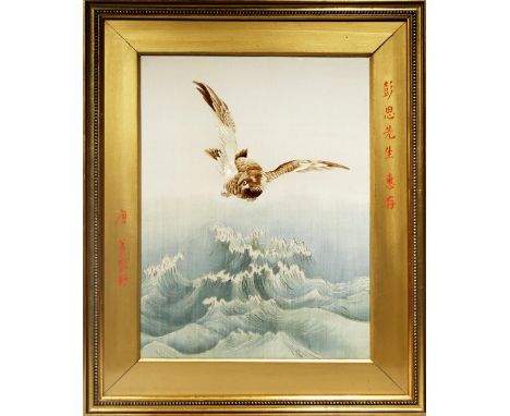 A JAPANESE EMBROIDERED PANEL MEIJI 1868-1912 Depicting an eagle flying over crashing waves, with calligraphy in red paint, fr