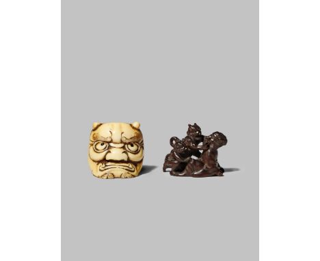 TWO JAPANESE NETSUKE MEIJI 1868-1912 One in ivory depicting a large oni mask on one side and Okame throwing beans on Setsubun