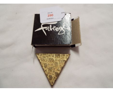 A vintage 1960s Faberge gilt metal pyramid shaped compact with elephant and palm tree design, in original box (replacement po