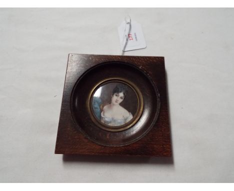 A late 19thC/early 20thC portrait miniature on ivory of a seated female study (after the European ladies), indistinctly signe