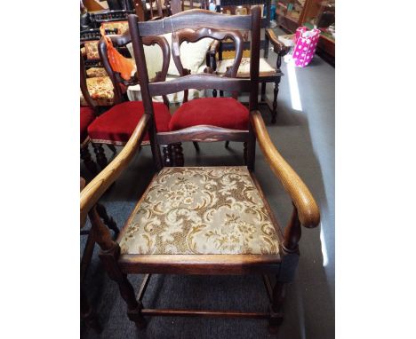 An oak farmhouse ladder-back elbow chair