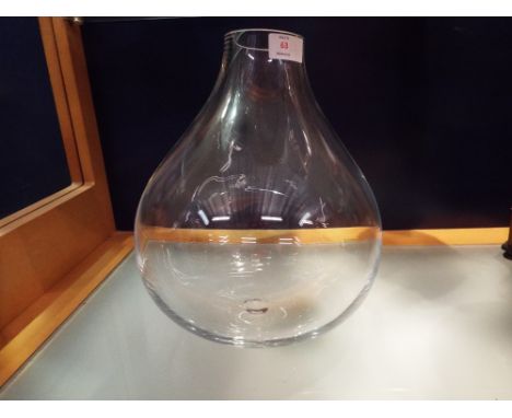 A designer art glass vase signed 'Linley' to the base in the form of a light bulb