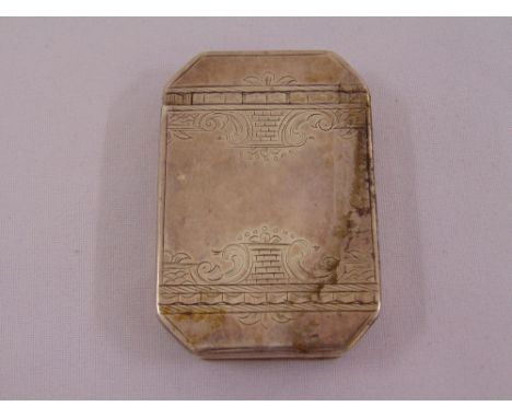 A late 18th century silver snuff box of elongated octagonal form, the hinged cover engraved with scrolls and geometric forms,
