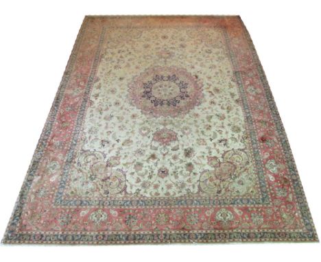 VERY FINE PART SILK TABRIZ CARPET, 357cm x 245cm, central medallion on an ivory field of scrolling vines and palmettes inside