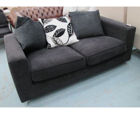 SOFA, two seater, black on chromed metal supports with three scatter cushions, 184cm L.