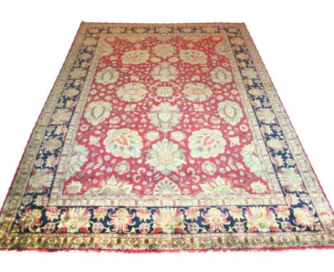 FINE ROYAL AGRA CARPET, 380cm x 268cm, oversized palmettes, vines and flowerheads on a terracotta field inside multiple organ