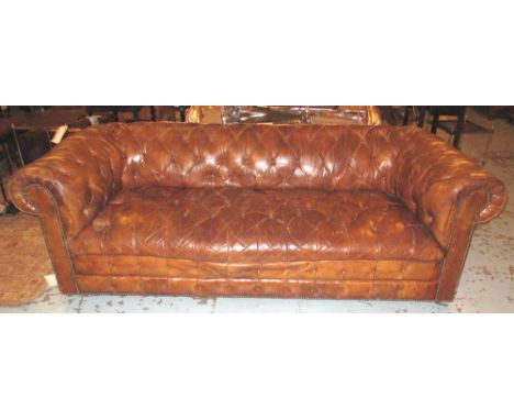 CHESTERFIELD SOFA, upholstered in distressed buttoned brown leather, 220cm L x 90cm D. (with faults)