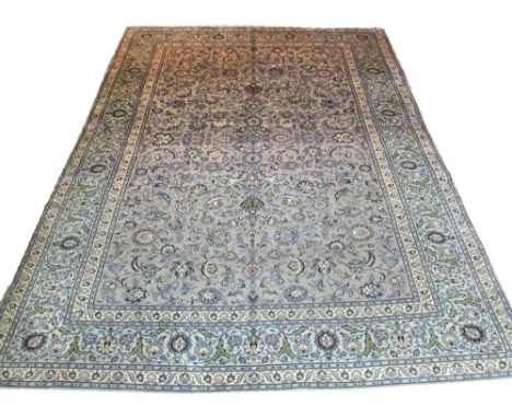 VERY FINE KASHAN CARPET, 380cm x 275cm, all over design of palmettes and scrolling vines on an antique jade field inside corr