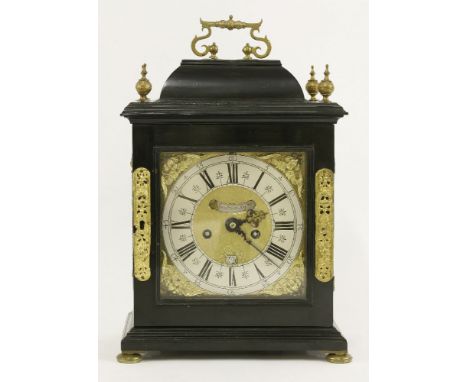 An ebonised bracket clock, late 17th century, by Edward Speakman, the 7in brass dial with cherub spandrels, with a matted cen