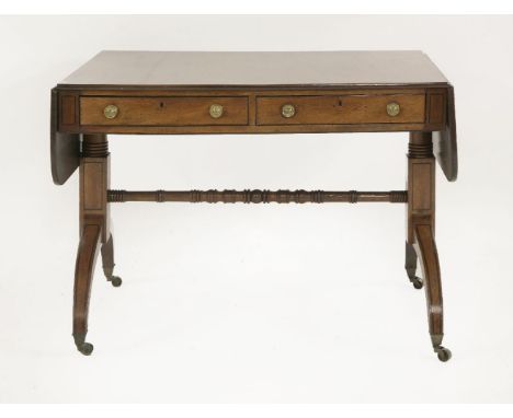 A George III mahogany and ebony inlaid sofa table,with two frieze drawers, on strut end supports united with a turned stretch