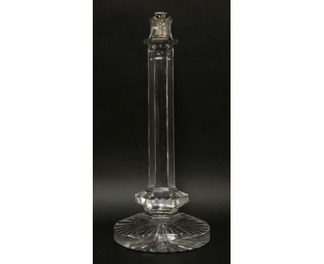 An Edwardian clear glass table lamp,with a loose collar, a faceted column and star cut base,48cm high