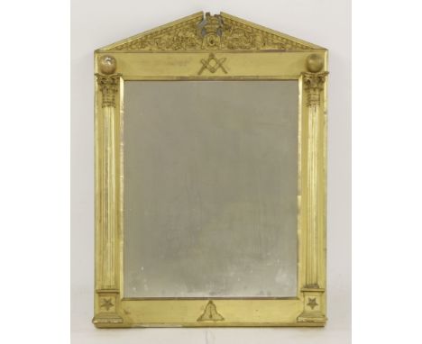 A giltwood and gesso wall mirror,19th century, the architectural crest with scrolled and Masonic motifs over applied squares,
