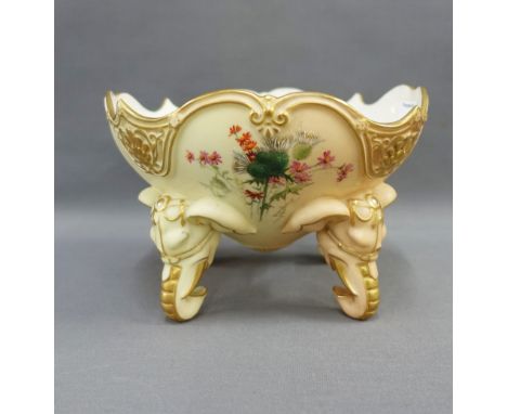 Royal Worcester blush ivory bowl raised on elephant head feet, painted with thistles to the interior, shape 1018, green print