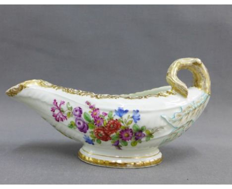 English porcelain cos lettuce sauceboat in the Worcester style, painted with flowers with gilt decorated rims, with a gold an