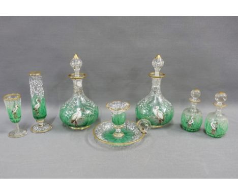 Collection of enamelled glass, painted with stork and lily of the valley pattern, comprising a pair of decanters with stopper