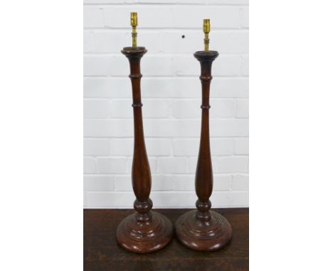 A pair of modern mahogany table lamp bases, 70cm (2)