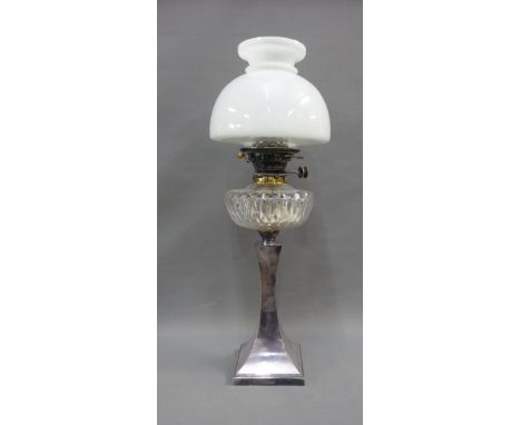 Oil lamp with an Epns base, clear glass well and white opaque glass shade, overall height 62cm 