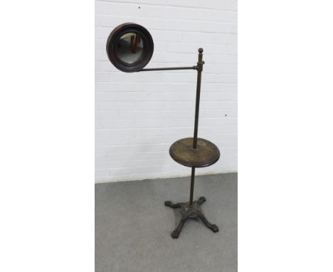 Early 20th century washstand with a cast metal base, oak shelf and circular mirror, 125cm high 