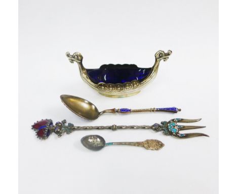 Silver Viking boat salt with a blue glass liner, Birmingham 1955 together with a silver gilt and blue enamel spoon and a cont