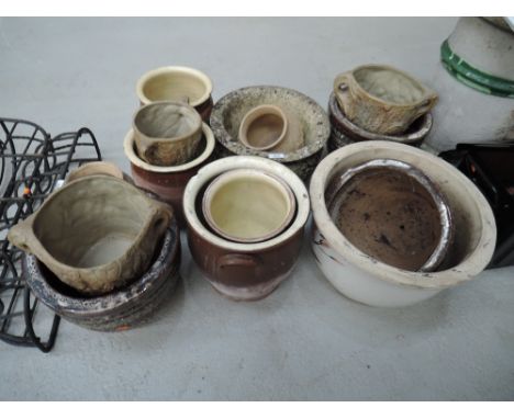 A selection of ceramic and salt glazed pots and planters