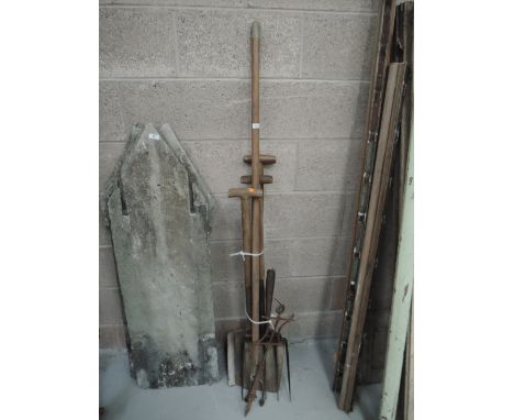 A selection of gardening tools including cast line marker