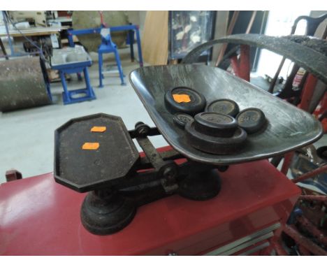 A set of vintage cast kitchen scales