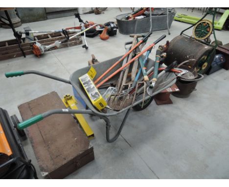 A wheelbarrow with tools 