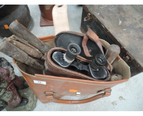A leather bag full of tools