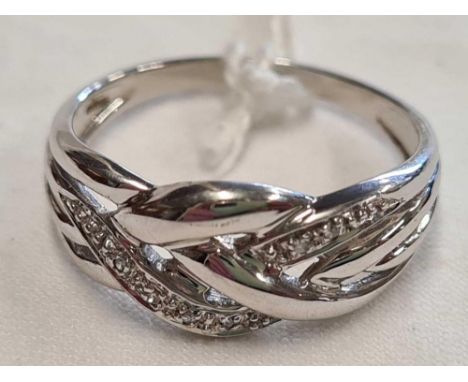 A 9CT WHITE GOLD KEEPER RING SET WITH ROSE DIAMONDS