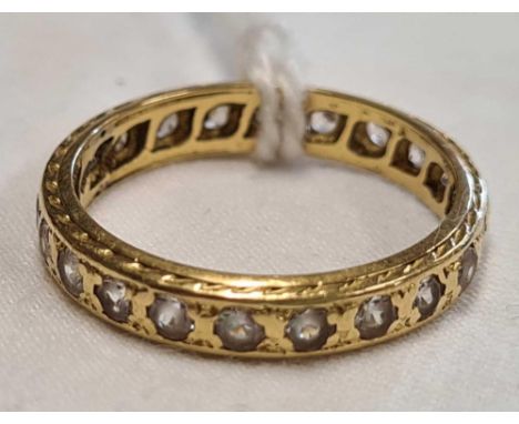 AN 18ct GOLD MOUNTED ETERNITY RING